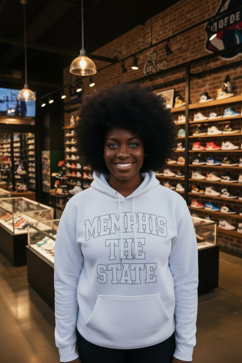 White hoodie with 'MEMPHIS THE STATE' text on a beige background